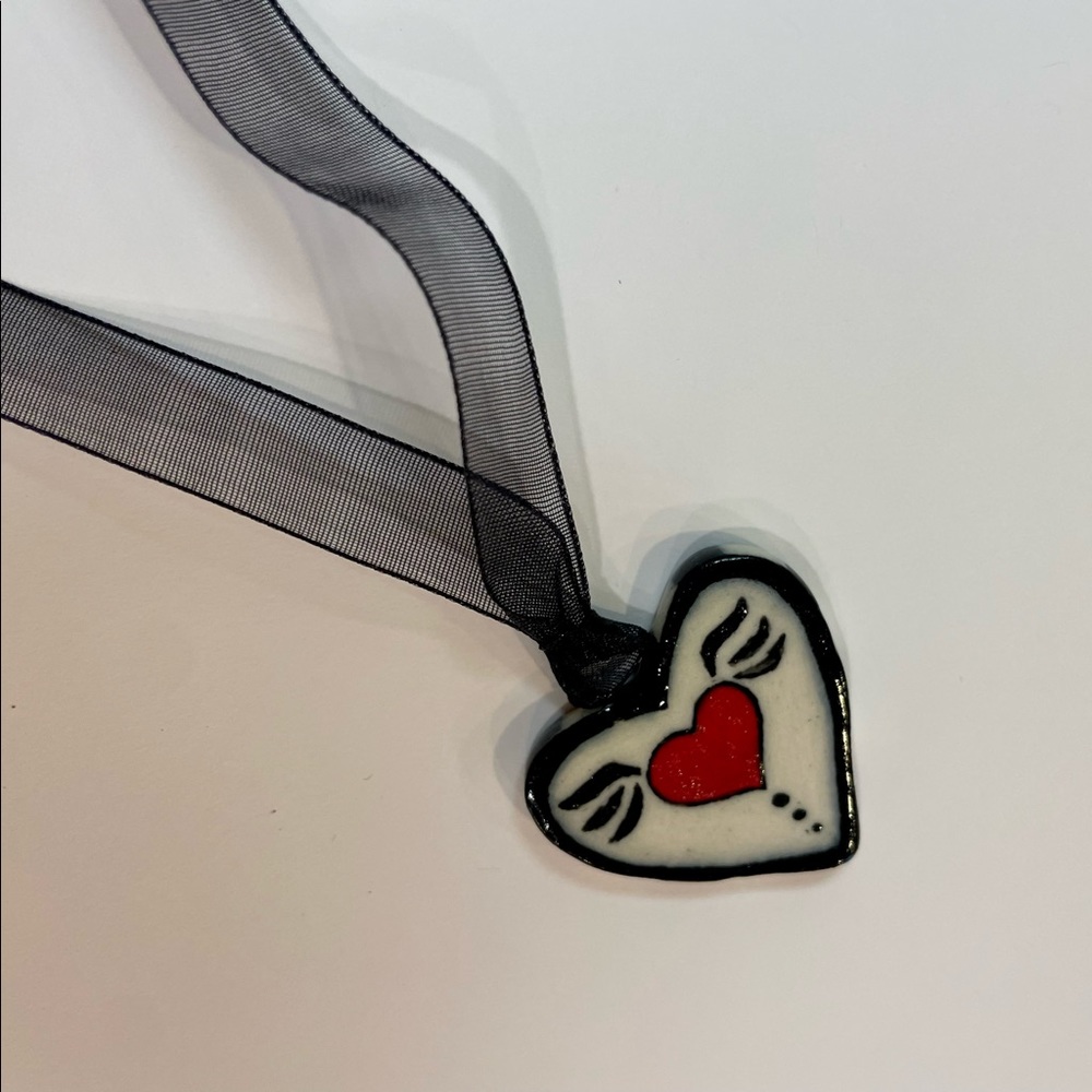 Handmade ceramic heart necklace with black gossamer strap